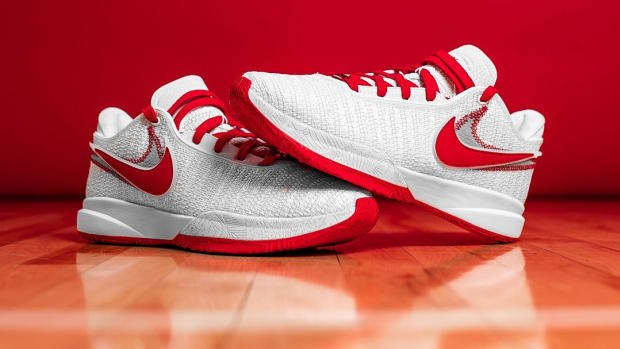 White and red Nike LeBron shoes.